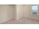 Bright bedroom featuring neutral walls and carpet with a large window offering natural light at 1645 W Baseline Rd # 2098, Mesa, AZ 85202