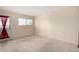 Well lit bedroom with neutral carpet and a sliding glass door leading to the balcony at 1645 W Baseline Rd # 2098, Mesa, AZ 85202