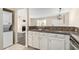 Kitchen view with stainless steel appliances, updated cabinets, and breakfast bar at 1645 W Baseline Rd # 2098, Mesa, AZ 85202