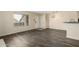 Bright living room with wood floors, natural light, and fresh paint at 1645 W Baseline Rd # 2098, Mesa, AZ 85202