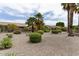 Low-maintenance backyard featuring mature landscaping, gravel, and desert plants at 16514 W Sandia Park Dr, Surprise, AZ 85374
