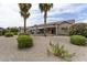 Well-maintained backyard with desert landscaping and multiple patio areas at 16514 W Sandia Park Dr, Surprise, AZ 85374