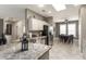 Open kitchen with stainless steel appliances, granite countertops, and convenient breakfast bar seating at 16514 W Sandia Park Dr, Surprise, AZ 85374