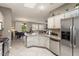 Bright kitchen features granite countertops, stainless steel appliances, and an open layout at 16514 W Sandia Park Dr, Surprise, AZ 85374