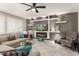 Cozy living room featuring a modern fireplace and comfortable sofa at 16514 W Sandia Park Dr, Surprise, AZ 85374