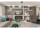 Stylish living room features a modern fireplace, elegant decor and comfortable sofa at 16514 W Sandia Park Dr, Surprise, AZ 85374