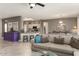 Spacious living area open to kitchen with breakfast bar at 16514 W Sandia Park Dr, Surprise, AZ 85374