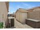 View of the side yard featuring a shed, gravel landscaping, and an AC unit at 17292 W Pinnacle Vista Dr, Surprise, AZ 85387