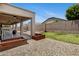 Backyard with rock landscaping, putting green, covered patio, and string lights at 17292 W Pinnacle Vista Dr, Surprise, AZ 85387