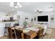 Open concept dining area with view into living room and modern decor at 17292 W Pinnacle Vista Dr, Surprise, AZ 85387