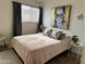 Serene bedroom featuring a plush bed, stylish decor, and soft natural light at 1823 E Kirkland Ln # C, Tempe, AZ 85281