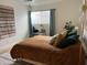 Cozy bedroom features a ceiling fan, modern decor, and comfortable brown bedding at 1823 E Kirkland Ln # C, Tempe, AZ 85281