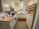 Efficient kitchen featuring modern appliances, ample storage, and bright lighting at 1823 E Kirkland Ln # C, Tempe, AZ 85281