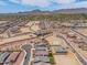A residential community featuring desert landscape, new construction, wide streets, and mountain views at 19968 W Flower St, Buckeye, AZ 85396