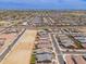 Wide aerial shot of a growing residential neighborhood highlighting new homes and empty lots ready for development at 19968 W Flower St, Buckeye, AZ 85396