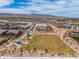 Scenic aerial view of a community park and surrounding neighborhood with a mountain backdrop on a sunny day at 19968 W Flower St, Buckeye, AZ 85396