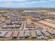Expansive aerial view of a well-planned community showcasing many single-Gathering homes and desert landscaping at 19968 W Flower St, Buckeye, AZ 85396