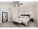 Inviting primary bedroom featuring neutral tones, a plush upholstered headboard and soft textures at 19968 W Flower St, Buckeye, AZ 85396