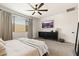 Serene primary bedroom featuring plush textures, a ceiling fan and modern furniture at 19968 W Flower St, Buckeye, AZ 85396
