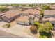 Beautiful two-story house with a well-manicured lawn, three-car garage, and Spanish tile roof in quiet neighborhood at 2102 S Sabrina --, Mesa, AZ 85209