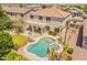 View of backyard with a freeform pool, spa, covered patio, and well-manicured landscaping at 2102 S Sabrina --, Mesa, AZ 85209