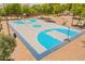 Up close aerial view of a well-maintained basketball court with colorful blue accents at 2102 S Sabrina --, Mesa, AZ 85209
