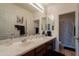 Bright bathroom featuring double sink vanity and shower/tub with curtain at 2102 S Sabrina --, Mesa, AZ 85209