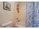 Toilet and tub/shower combination with decorative curtain in a bright bathroom at 2102 S Sabrina --, Mesa, AZ 85209