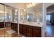 Bright bathroom featuring a vanity with double sinks and a large mirror at 2102 S Sabrina --, Mesa, AZ 85209