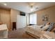 Bedroom with ceiling fan, carpeting, a large closet with folding doors, and plenty of natural light at 2102 S Sabrina --, Mesa, AZ 85209