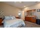Bedroom displaying carpet, a ceiling fan, light walls, furniture, and entry to another room at 2102 S Sabrina --, Mesa, AZ 85209