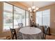Bright breakfast nook featuring a chandelier and views of the landscaped backyard at 2102 S Sabrina --, Mesa, AZ 85209