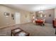 Bright dining room featuring tile flooring, a dining table set, and elegant chandelier at 2102 S Sabrina --, Mesa, AZ 85209
