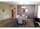Charming dining room with tile floors, a dining table set, and warm natural light at 2102 S Sabrina --, Mesa, AZ 85209