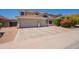 Charming two-story house with a three-car garage, beautiful landscaping, and inviting curb appeal in a friendly neighborhood at 2102 S Sabrina --, Mesa, AZ 85209