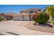Charming two-story home with a spacious three-car garage and beautiful landscaping, creating great curb appeal at 2102 S Sabrina --, Mesa, AZ 85209