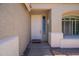 Inviting home entrance with neutral stucco, and a welcome mat at 2102 S Sabrina --, Mesa, AZ 85209