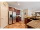 Kitchen with granite countertops, stainless steel appliances, and access to dining area at 2102 S Sabrina --, Mesa, AZ 85209