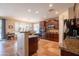 Spacious kitchen with granite countertops, dark wood cabinets, and modern appliances at 2102 S Sabrina --, Mesa, AZ 85209