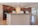 Kitchen view showcasing granite countertops and dark wooden cabinetry at 2102 S Sabrina --, Mesa, AZ 85209
