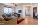 Bright and airy living room with window and door, and wood flooring at 2102 S Sabrina --, Mesa, AZ 85209