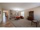 Open living and dining space boasts neutral walls, dining table and hutch at 2102 S Sabrina --, Mesa, AZ 85209