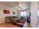 Bright Living room features cozy seating and is next to the Sewing Room at 2102 S Sabrina --, Mesa, AZ 85209