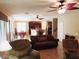 Inviting open-plan living space features tile floors, ceiling fans, and seamless flow to the kitchen at 2102 S Sabrina --, Mesa, AZ 85209