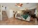 Open-concept living room with tiled floors, ceiling fans and staircase to second level at 2102 S Sabrina --, Mesa, AZ 85209