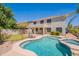 View of backyard pool and spa with manicured landscaping and covered patio at 2102 S Sabrina --, Mesa, AZ 85209