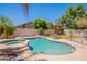 Backyard pool and spa surrounded by patio, landscaping, and fencing at 2102 S Sabrina --, Mesa, AZ 85209