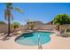 Backyard featuring a pool and spa with a lush tropical landscape at 2102 S Sabrina --, Mesa, AZ 85209