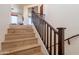 Wooden staircase with carpeted steps and dark-stained handrail at 2102 S Sabrina --, Mesa, AZ 85209
