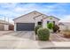 Charming single-story home with a desert landscape, complete with a two-car garage and ample parking space at 2614 S 120Th Ave, Avondale, AZ 85323